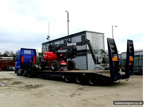 HIAB truck transporting a Manitou cherry picker in the North West